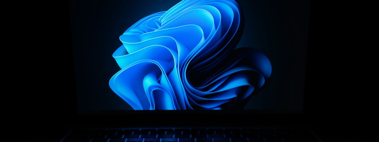 a macbook air laptop in the dark